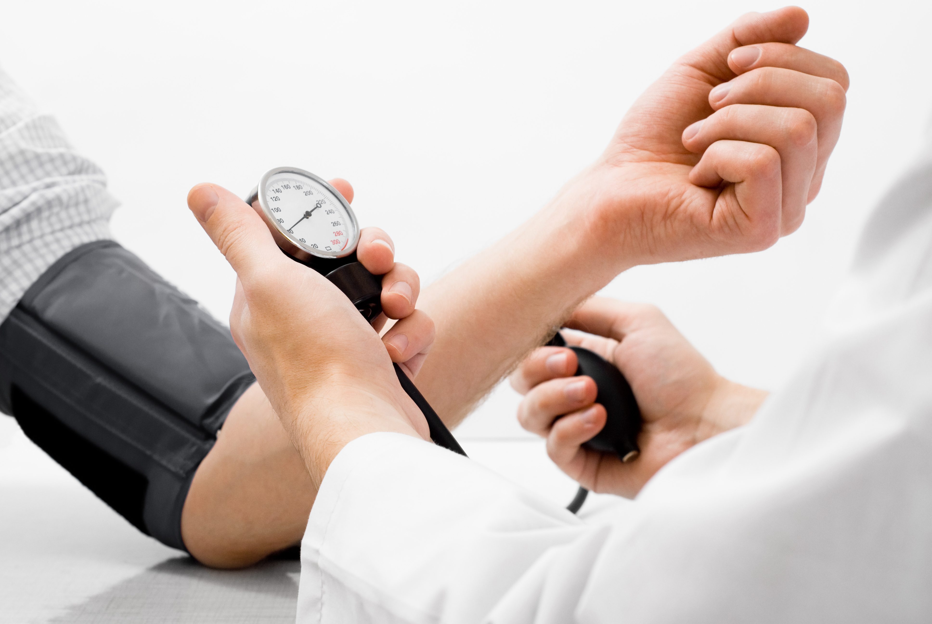 Doctor checking Persons Blood Pressure